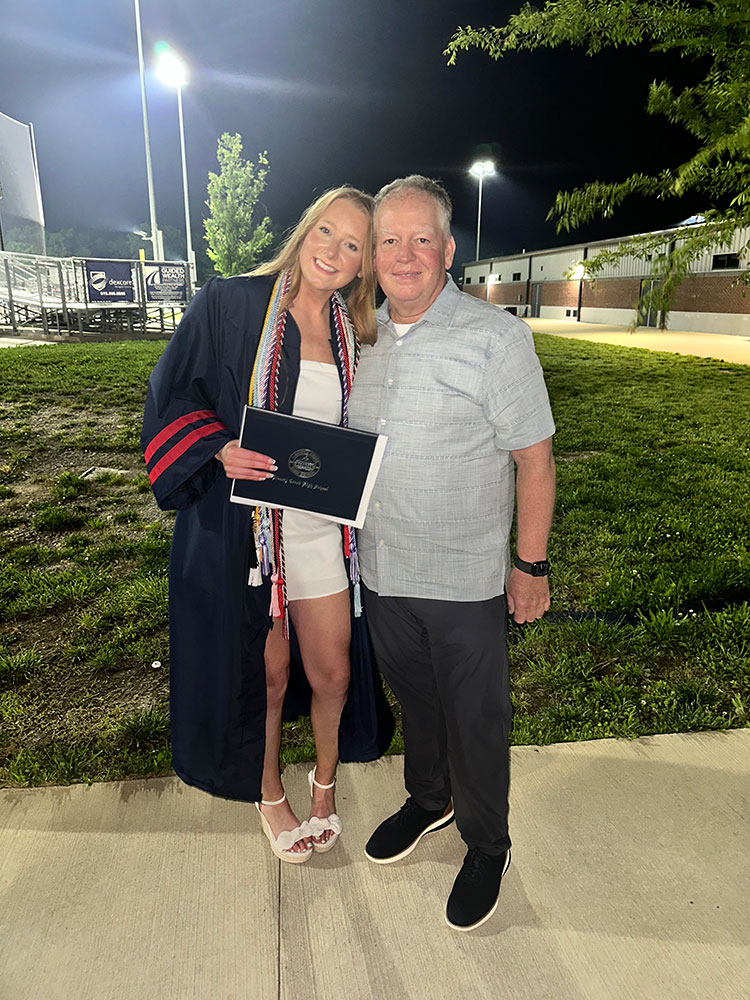 Katelyn Williams at high school graduation and standing next to Billy Austin.