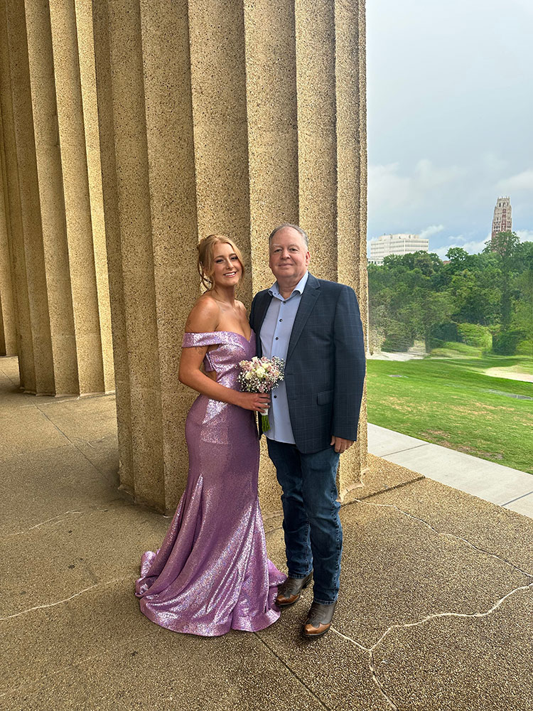 Katelyn Williams at prom and standing next to Billy Austin.