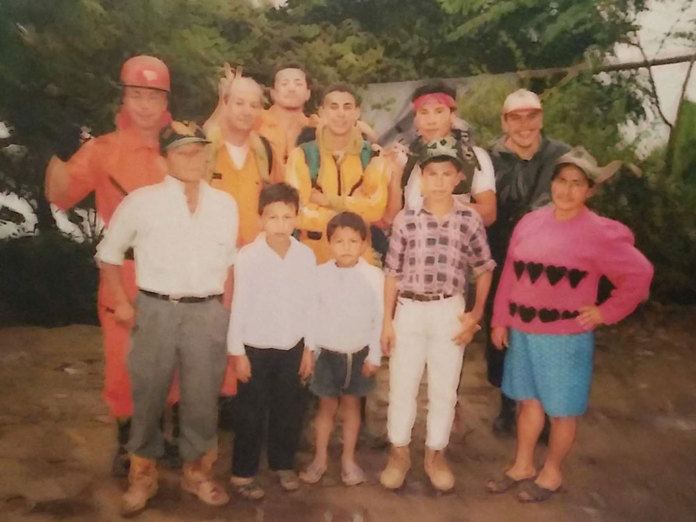group photo of rescue workers and locals.
