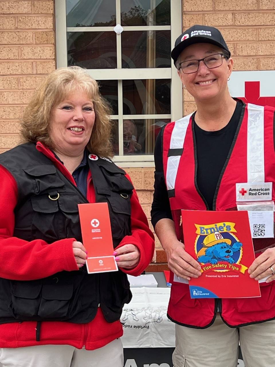 Melissa Gibson shares fire safety tips with another Volunteer