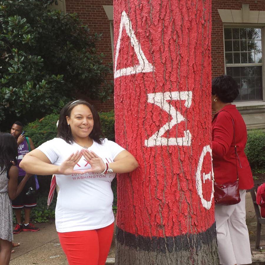 Toya in red and white representing her sorority.