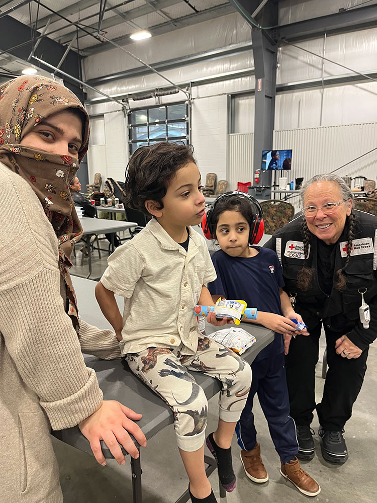 Ola and her sons and volunteer Eileen Wallach at Nashville Fairgrounds shelter.