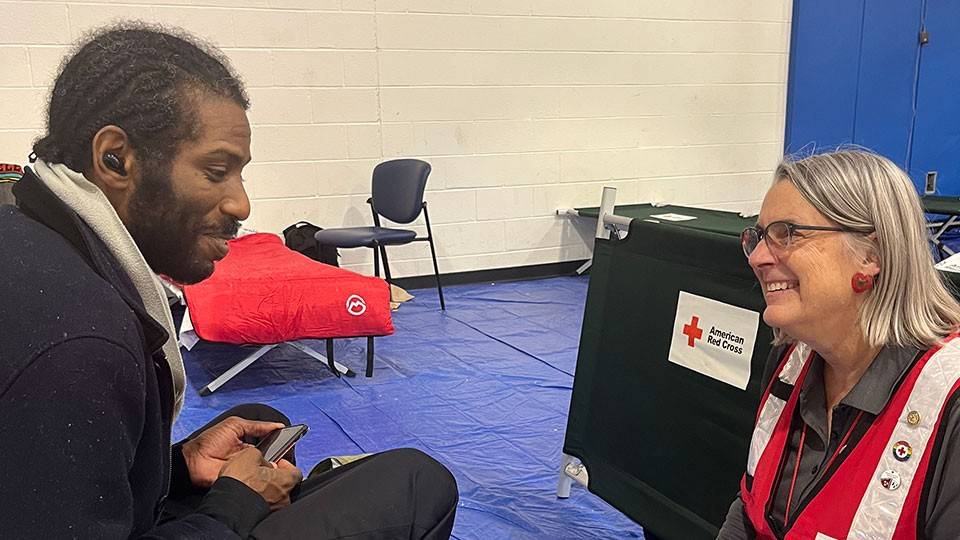 SRT volunteer Theresa Nelson and resident Chevan Williams in a Red Cross shelter.