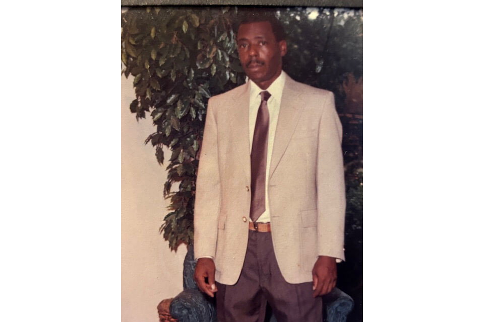 Terry Wheat Sr. wearing suit and tie.