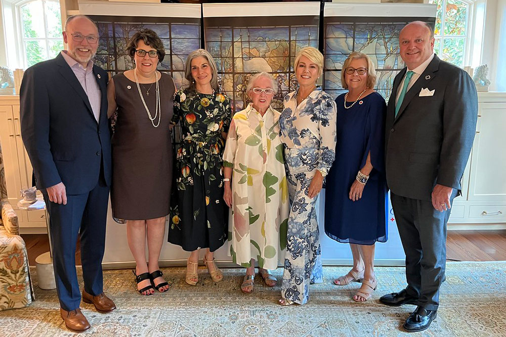 Group pic of Trevor Riggen, Keri McInnis, Joanne Sowell, Barbara Bovender, Marci Houff, Anna Trefethen and Joel Sullivan in dress clothing.
