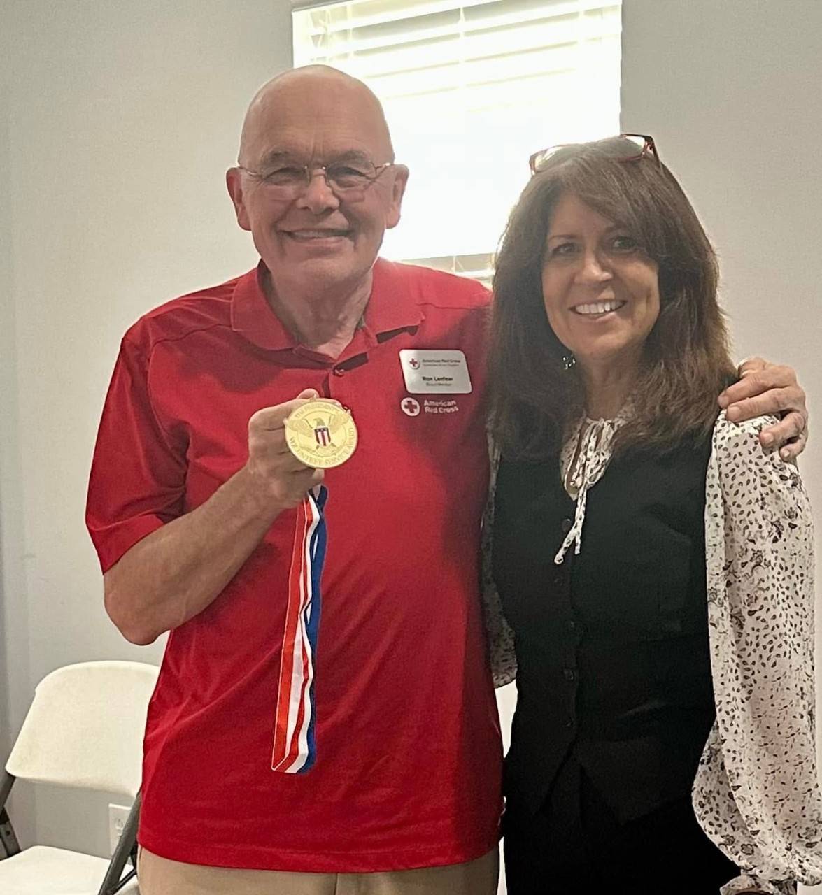 Volunteer Ron Lanfear with medal