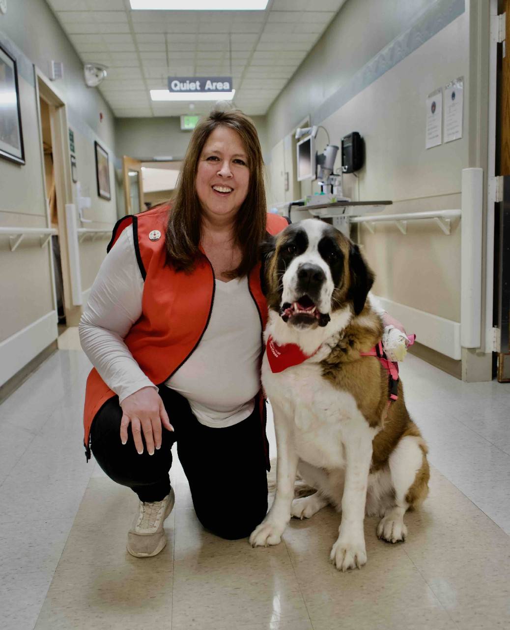 Therapy Dog Georgie with a Volunteer