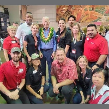 President Biden with Red Cross volunteers group photo.