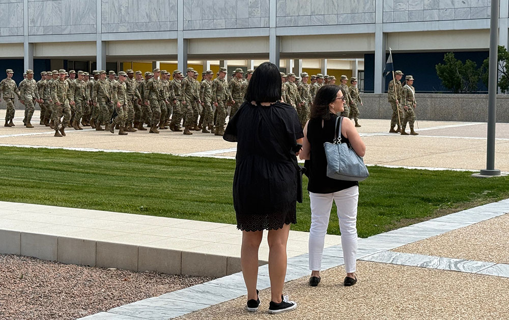 Tiffany Circle members and large group of Cadets Marching at the U.S. Air Force Academy.