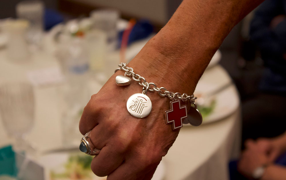 bracelet with charms on a Tiffany Circle member's wrist.