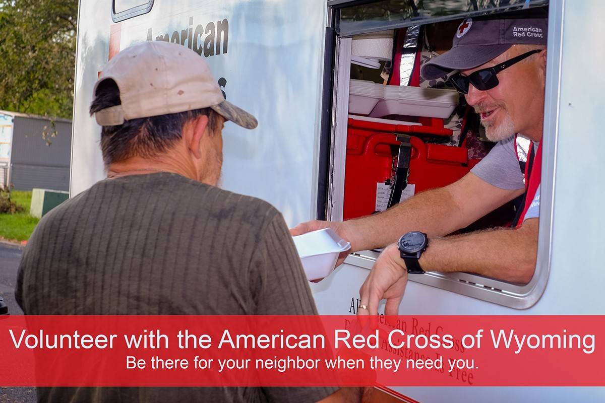 September 3, 2017. Victoria, Texas. Red Cross volunteer Charlie Magee of Laramie, Wyoming, hands out hot meals out of an Emergency Response Vehicle. Charlie was helped by the Red Cross when his home was affected by a tornado which motivated him to join the organization a year ago. He said, “The Red Cross symbol means help and that is why I’m here.”  
Photo by Chuck Haupt for the American Red Cross