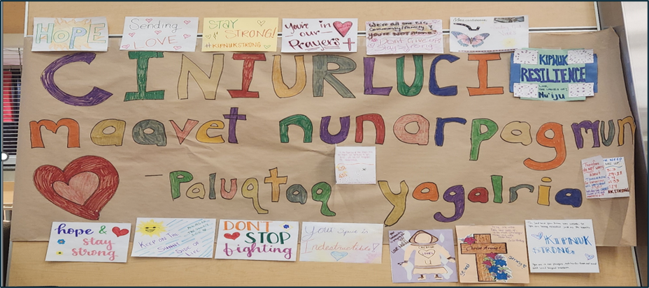 A poster in a Red Cross shelter holds handmade notes from those staying there 