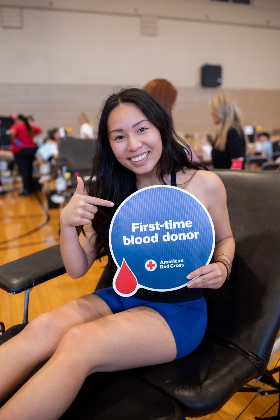 Woman donating blood to the Red Cross.