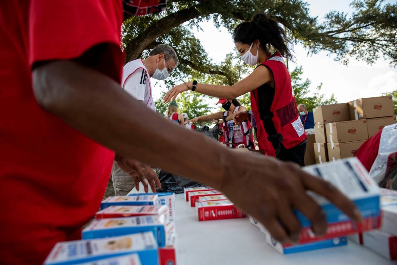 September 3, 2020. New Orleans, Louisiana
American Red Cross volunteers pack bags with food and snack items that will be handed out to people in need in areas hit hard by Hurricane Laura, at the American Red Cross headquarters in Baton Rouge, LA on Thursday, September 3, 2020.
Photo by Scott Dalton/American Red Cross