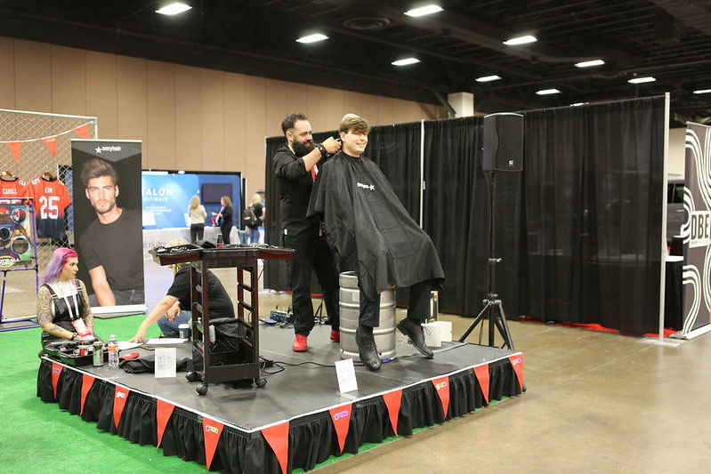 Person in chair getting haircut