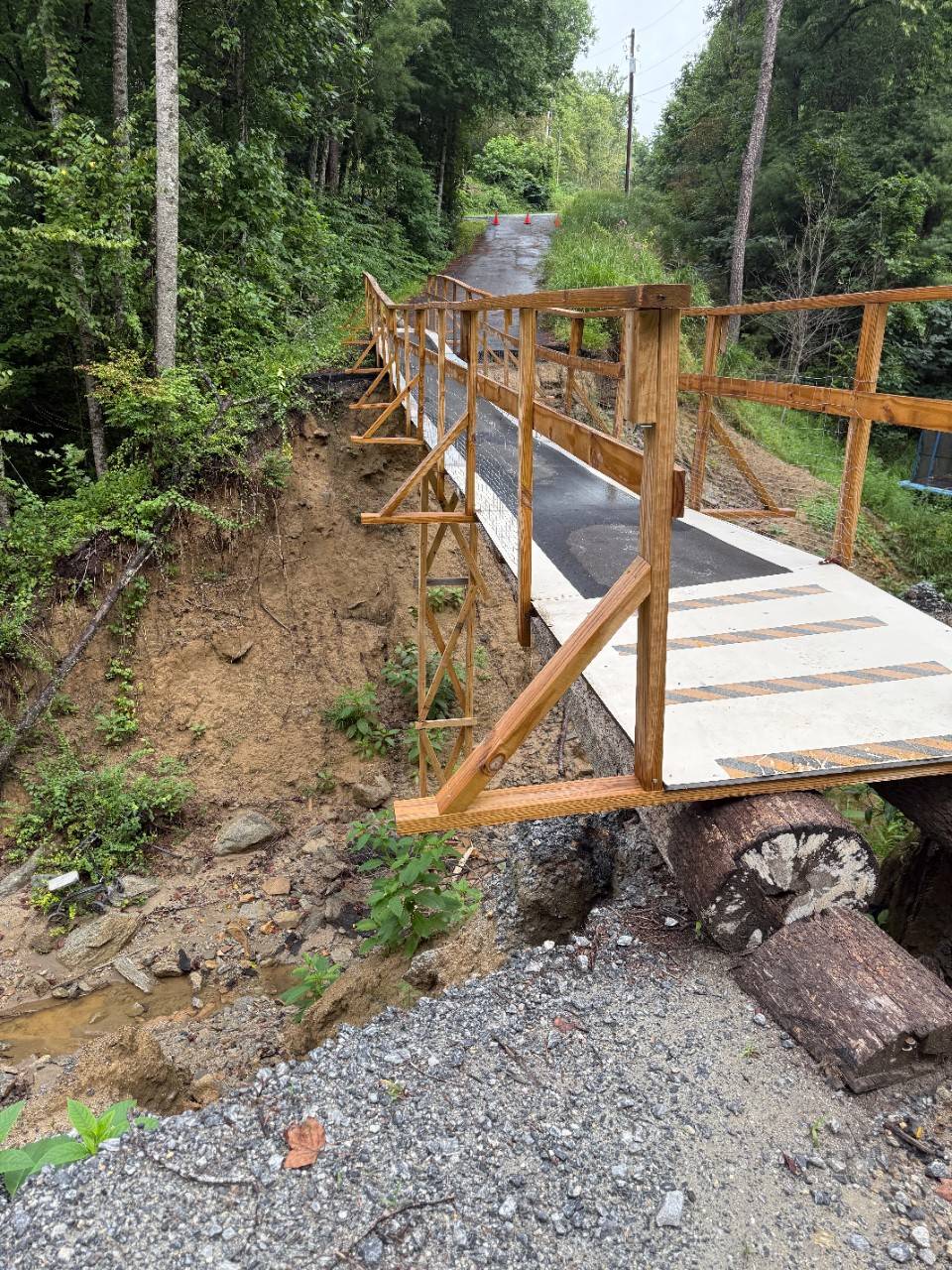 Bridge under construction in wooded area