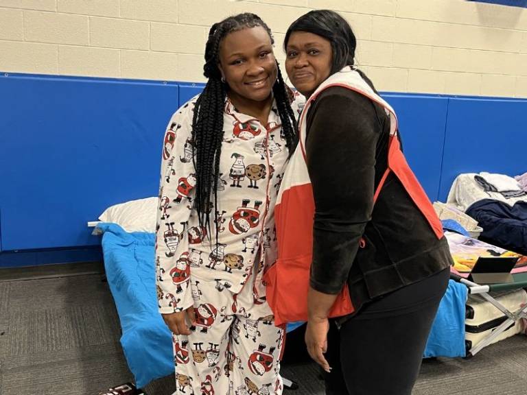 dezrielle moore standing with volunteer at columbus county shelter 