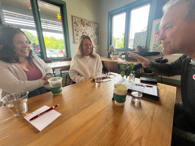 redcrosser conversing in coffee shop with kimberly and amber