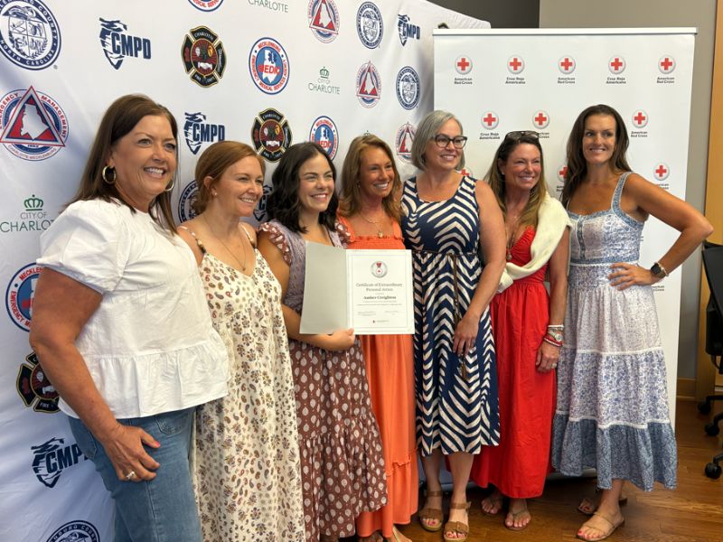 group of lifesaving award attendees posing with amber and kimberly
