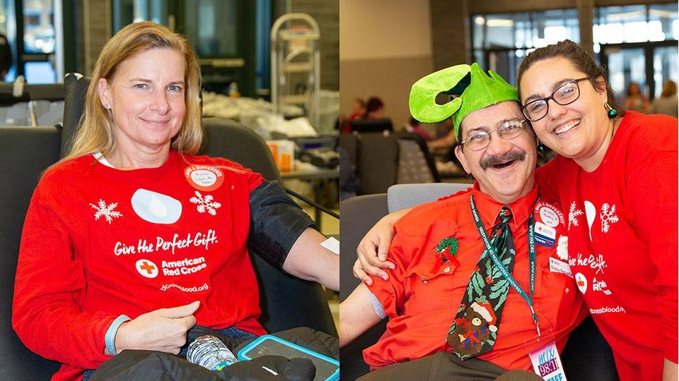 three people in holiday shirts and two of them sitting in a chair donating blood.