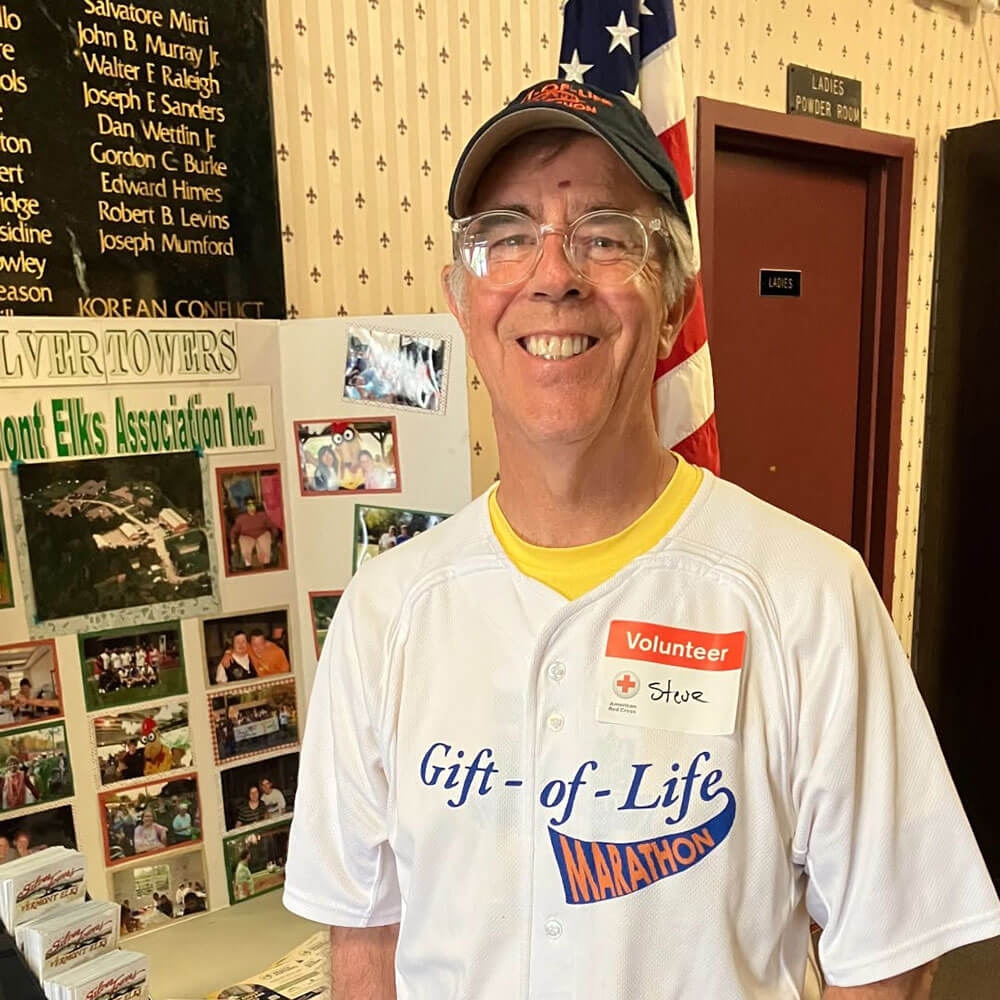 Steve Costello wearing a hat, glasses, and Gift of Life shirt.