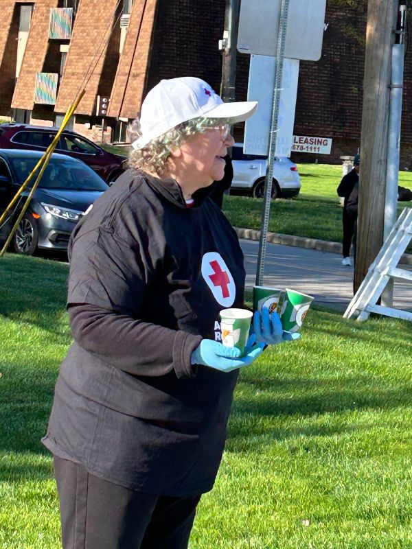 woman holding water cups