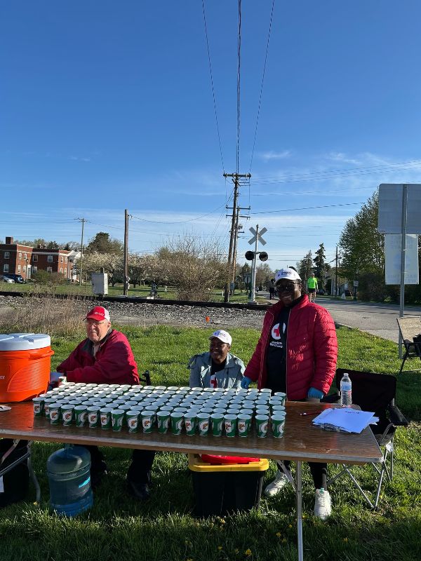 red crossers at water station table