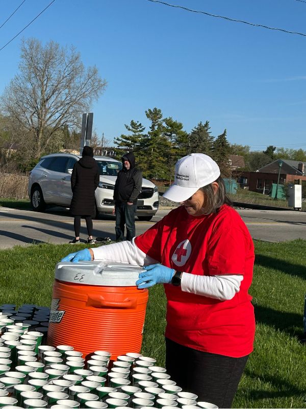 woman filling up water bucket