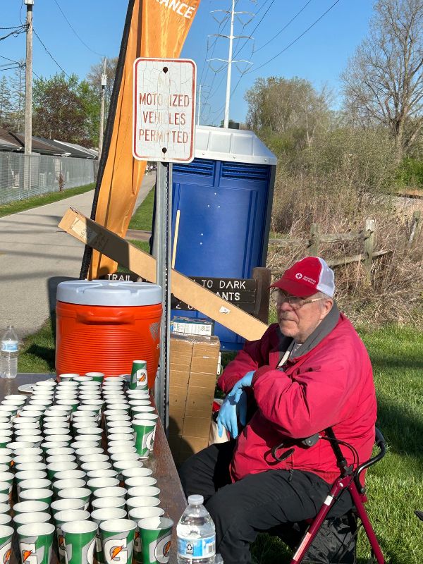 man sitting at water station.