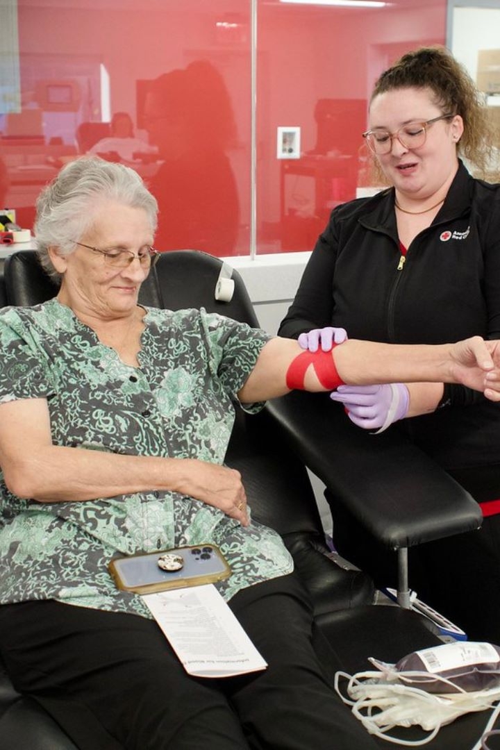 blood donor giving blood with Phlebotomist