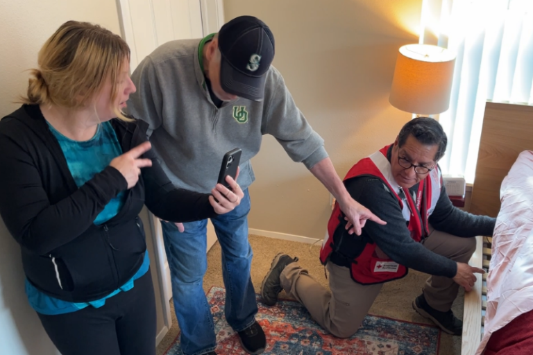 Red Cross volunteers install bed shaker alarm