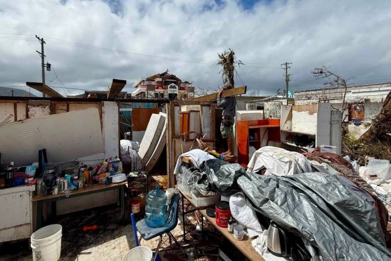 A neighborhood after disaster shows homes destroyed