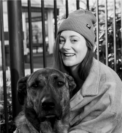 Black and white image of woman with dog