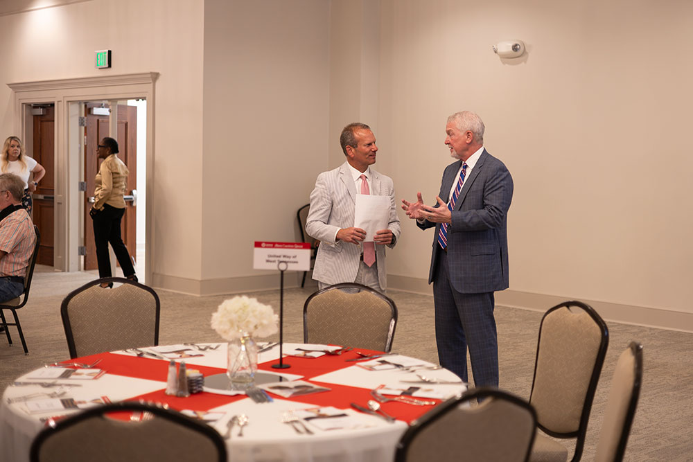 Guests talking to each other at the Mid-West Tennessee Heroes Luncheon..