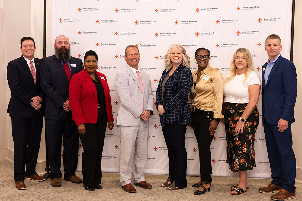 Group picture of eight guests at Mid-West Tennessee Heroes Luncheon..
