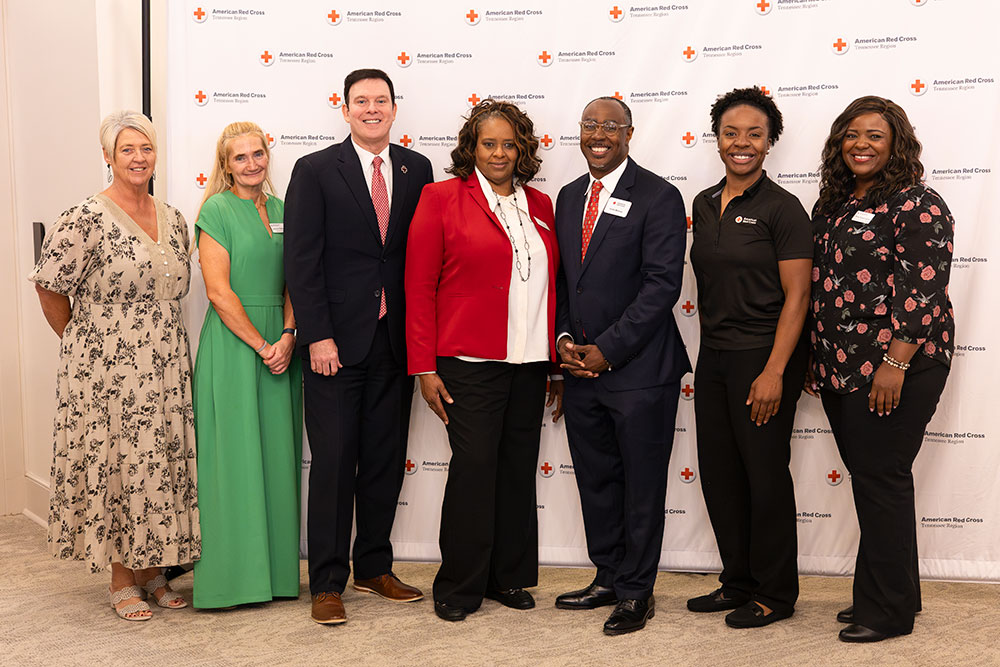 Group picture of seven guests at Mid-West Tennessee Heroes Luncheon..