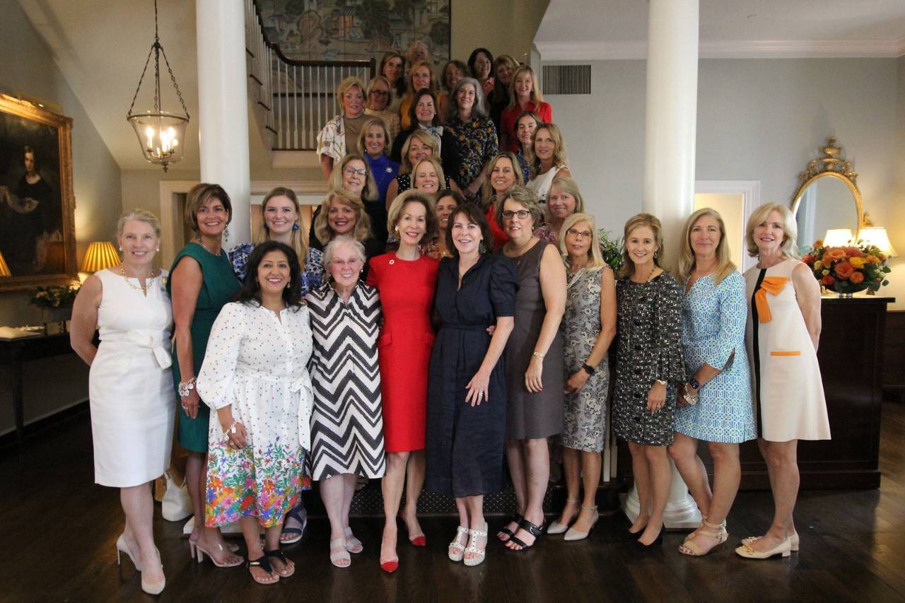 tiffany circle members standing on stairwell