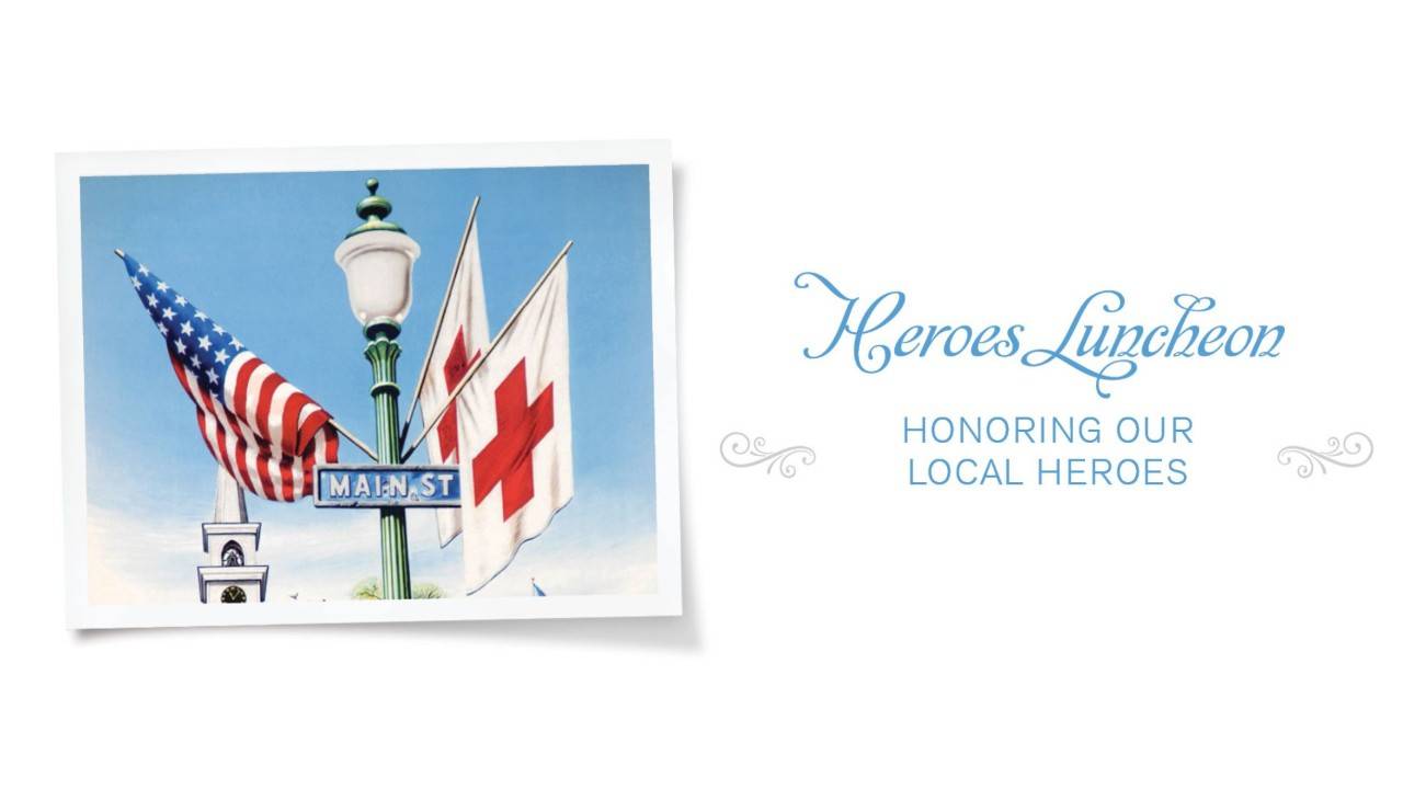 Heart of Tennessee Heroes event banner with an American flag, a Red Cross flag, and an Americana Main Street  Sign