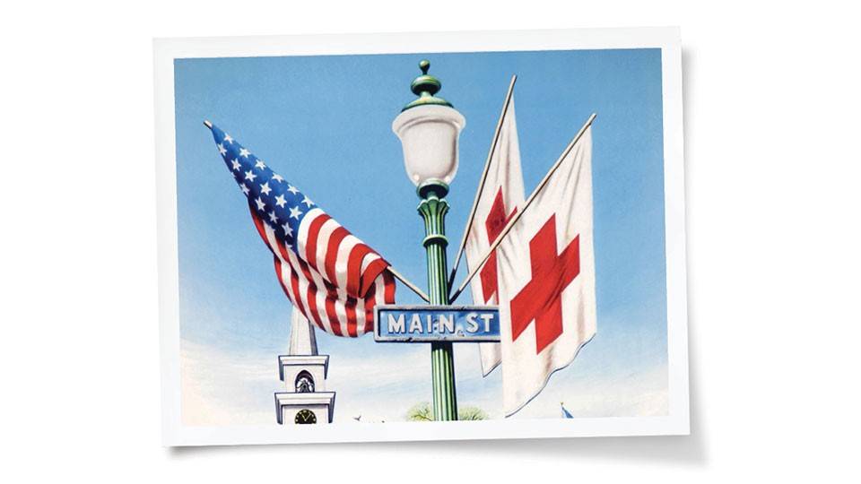 Heart of Tennessee Heroes event banner with an American flag, a Red Cross flag, and an Americana Main Street  Sign