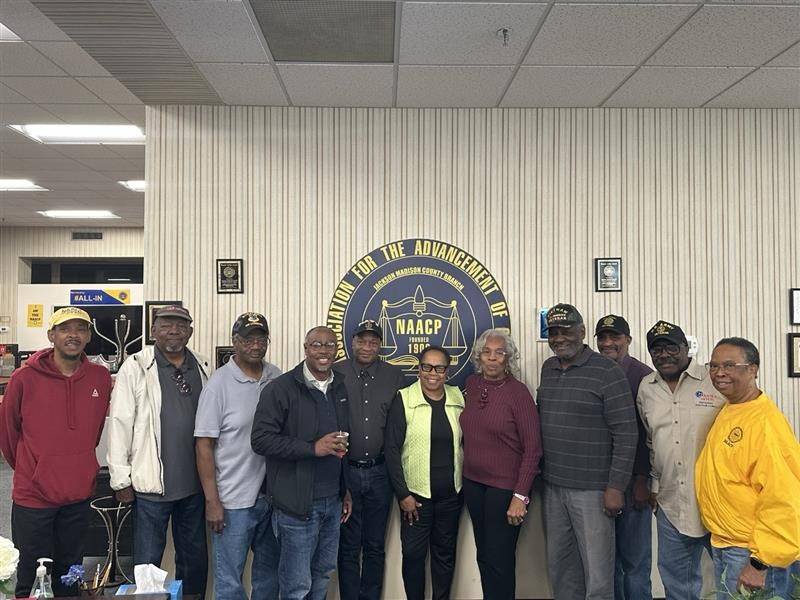 group of people pose for photo