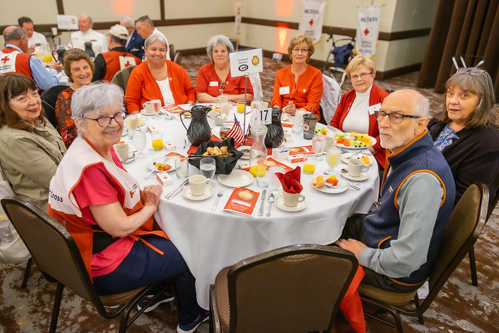 guests sitting at round dinner table at the Real Heroes Event.