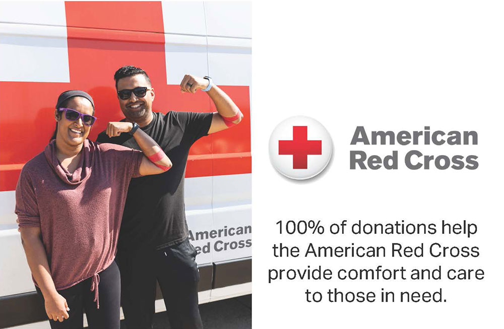 two people, with red bandages around their arm, flex their arms.