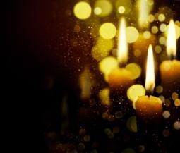 lit candles with a dark background