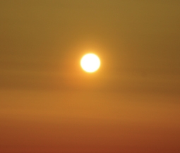 photograph of a bright sun in a cloudless sky