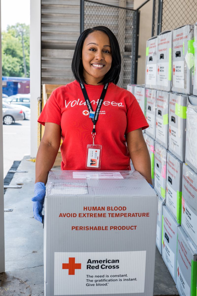 Red Cross volunteer transports blood products