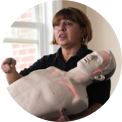 woman holding mannequin