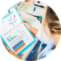 female looking at graphs on sheet of paper
