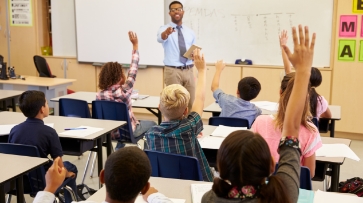 School teacher teaching a class the importance of first aid training