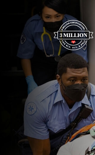 First responders transporting a patient on a wheeled stretcher.