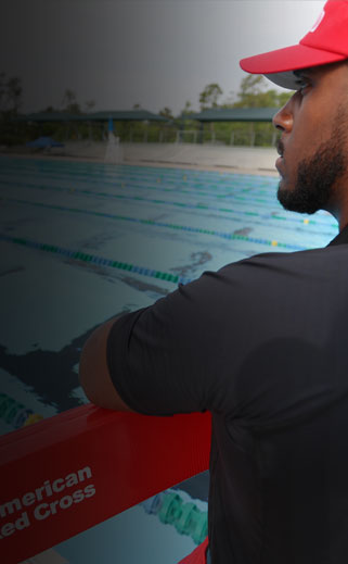 Red Cross certified lifeguard monitoring pool